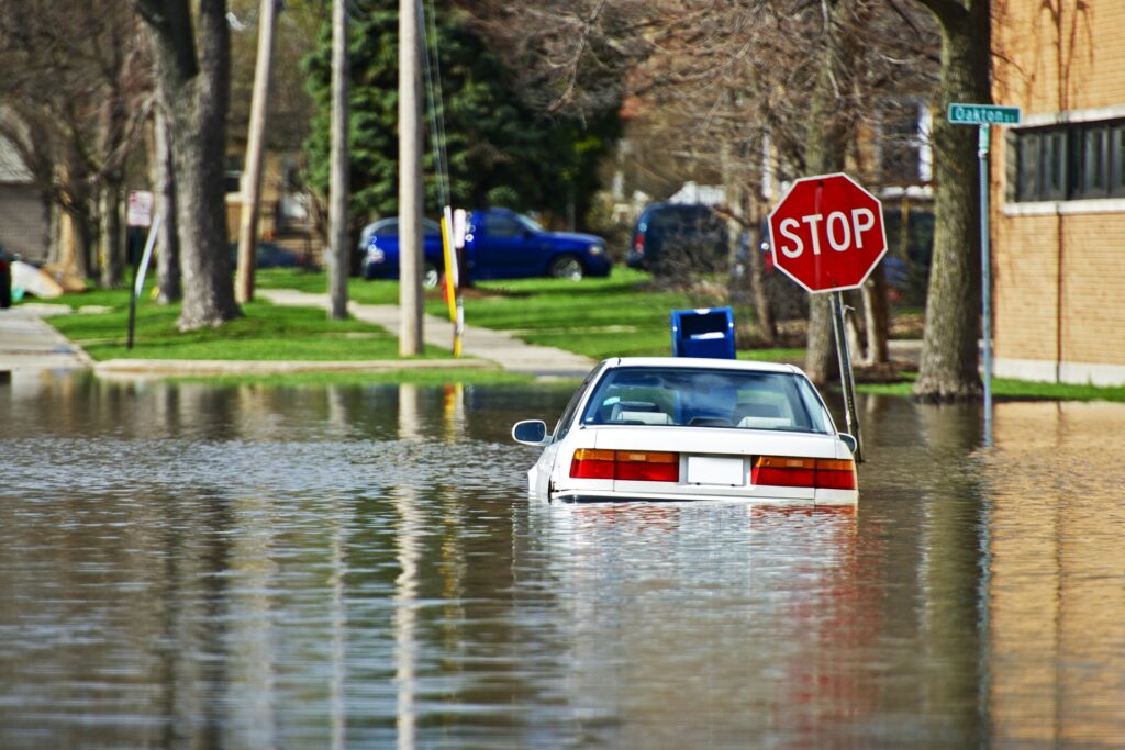 Michigan home surrounded by floodwater highlighting need for insurance